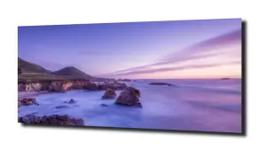 obraz na szkle Zachód słonca plaża i skały 