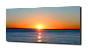 obraz na szkle Zachód słońca za horyzontem 